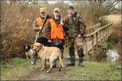 father-sons-dog-hunting